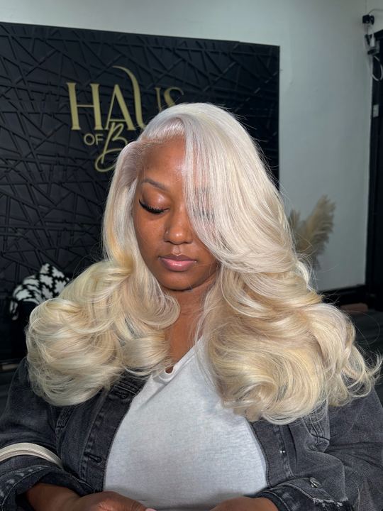 Platinum blonde layered install with face-framing bang